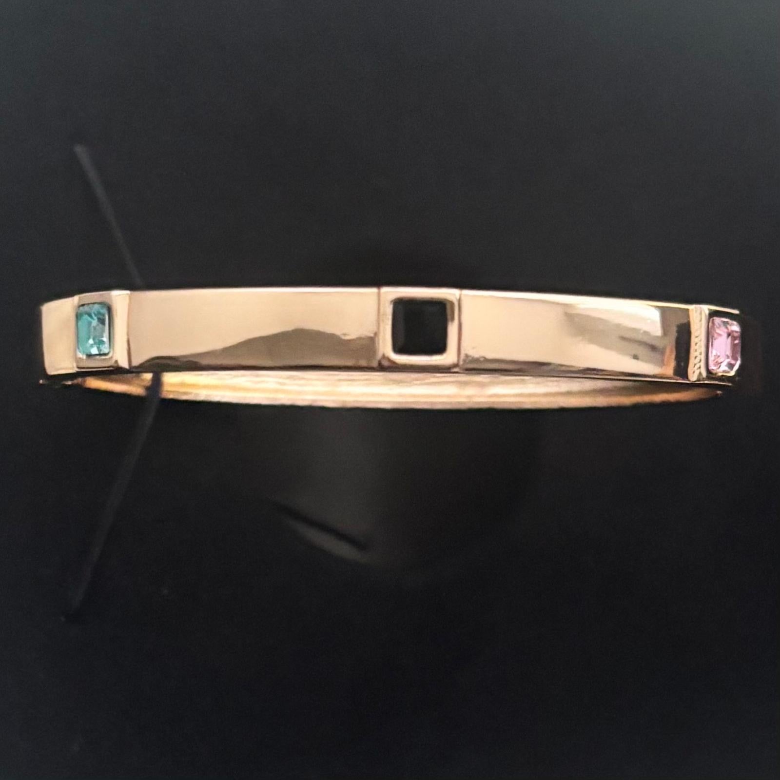 gold, solid bangle with multi colour diamante stones